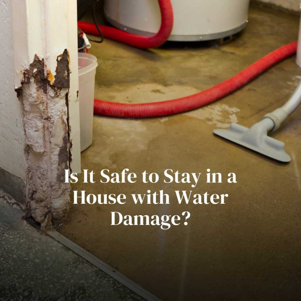Basement water damage with vacuum and dehumidifier.